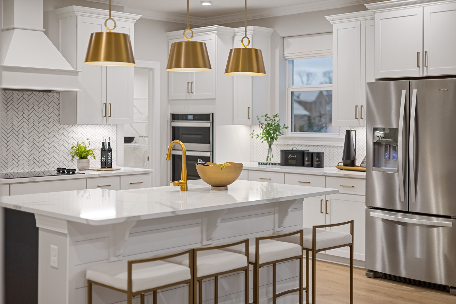 kitchen with white cabinets and gold hardware