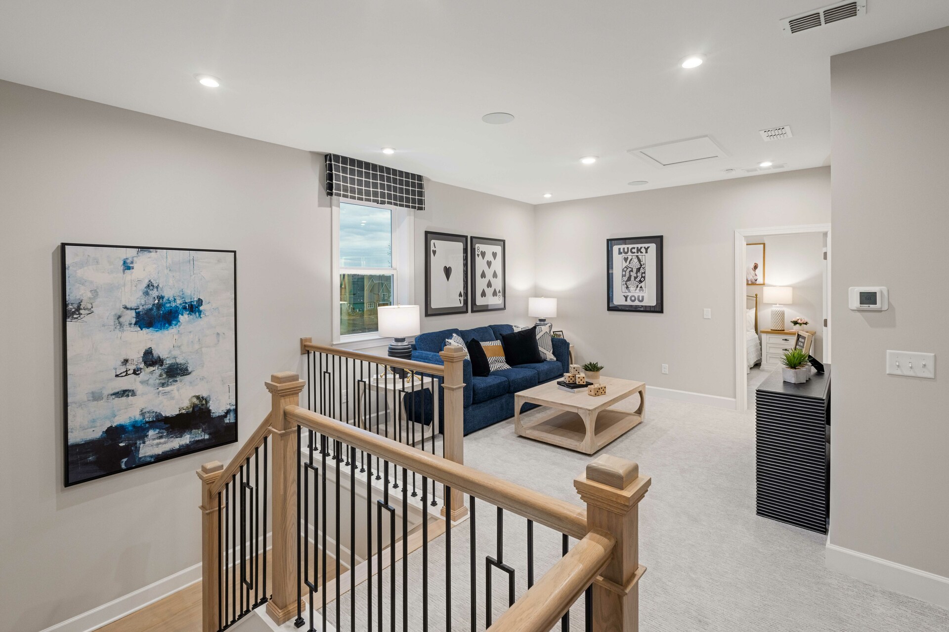 loft with carpet and oak tread staircase