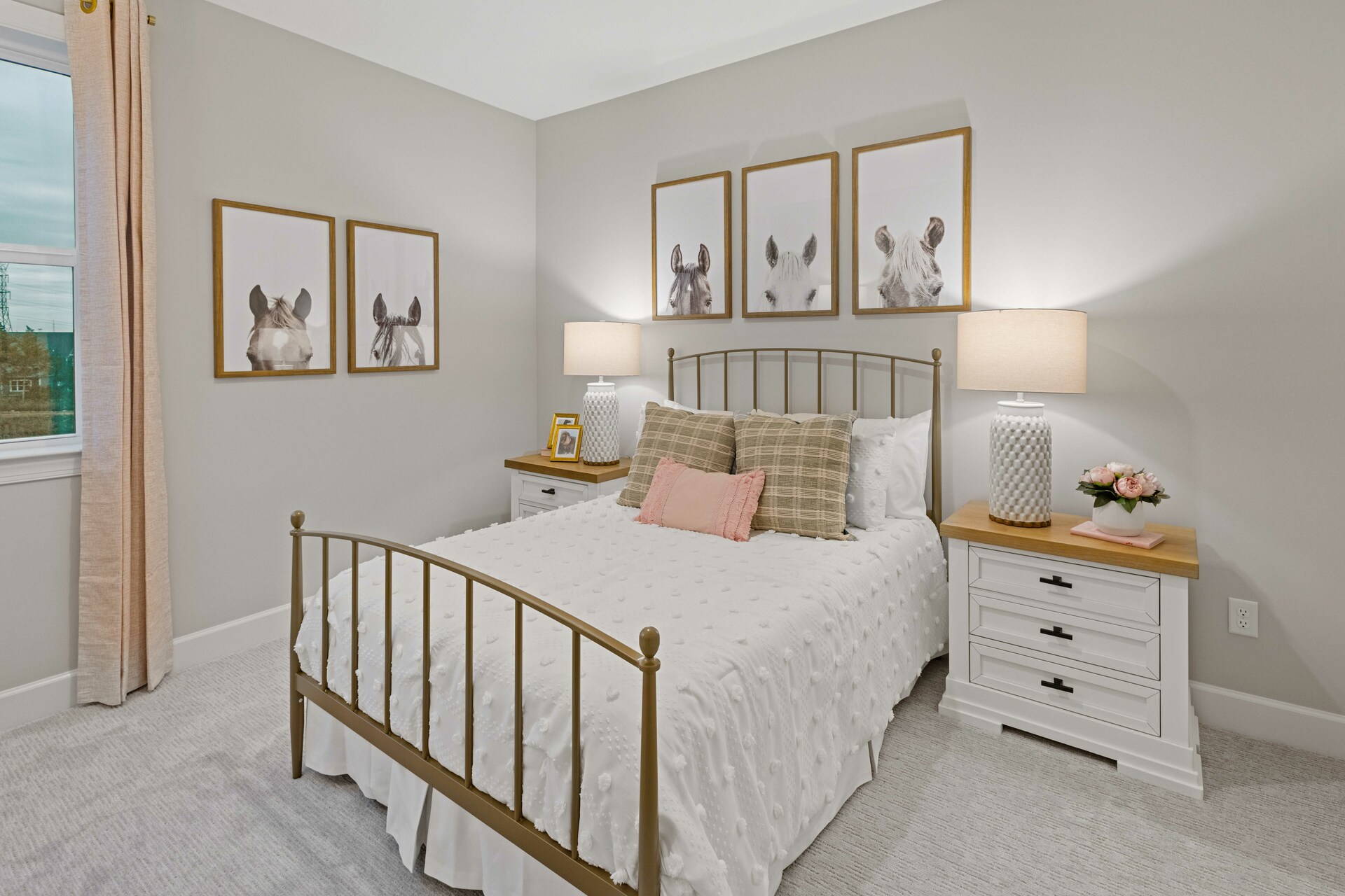 secondary bedroom with large windows and carpet