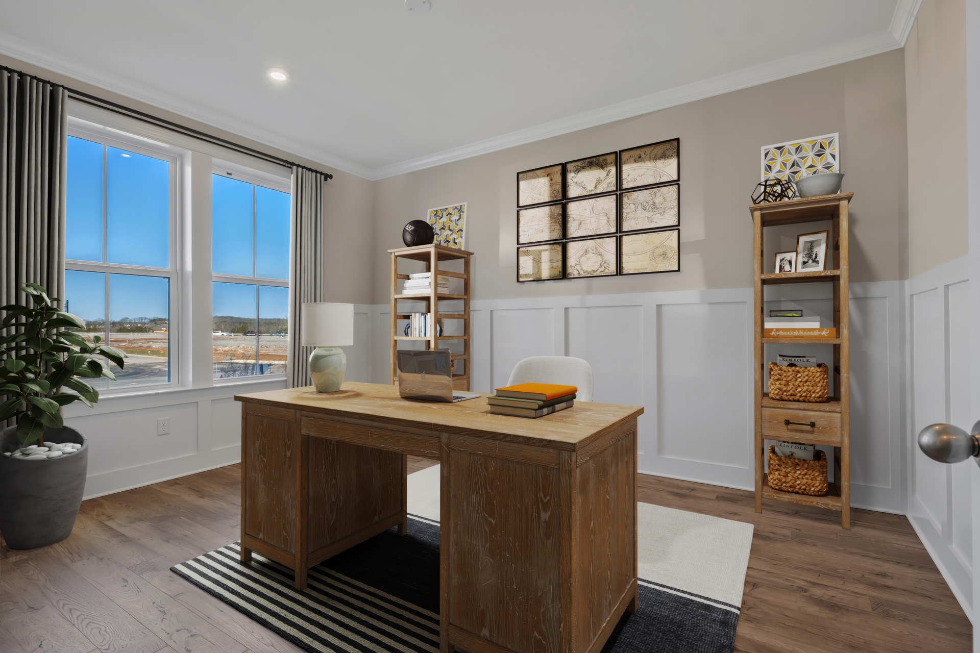 study with wood flooring, judges paneling on the walls and large windows