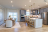 kitchen with a center island connecting to the breakfast area