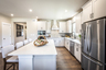 kitchen with white cabinets and quartz counters