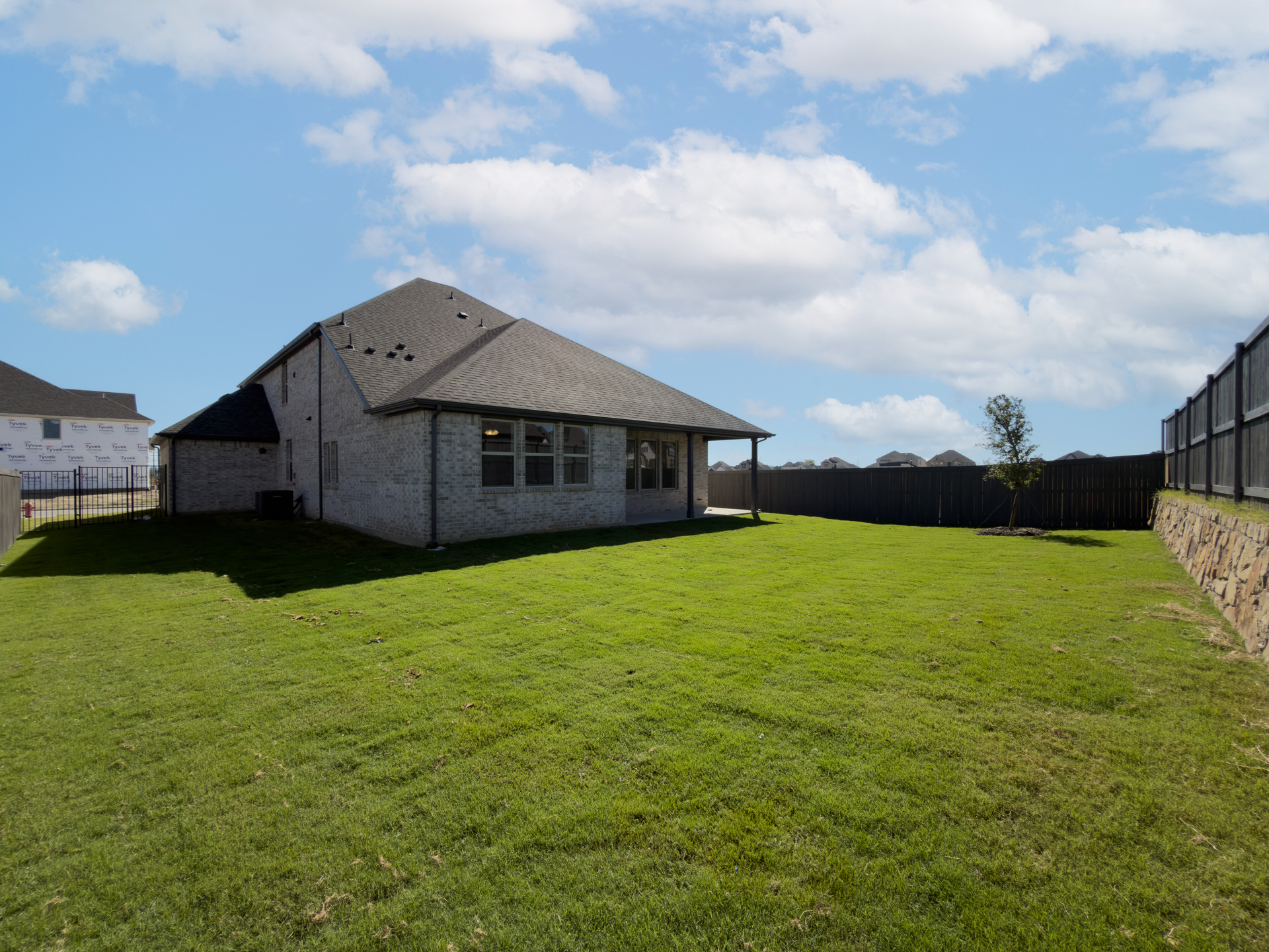 backyard of home with covered patio