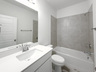 guest bathroom with soaking tub