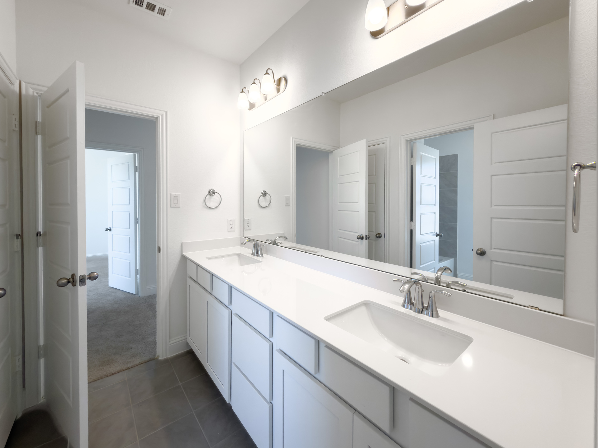 guest bathroom with double sinks