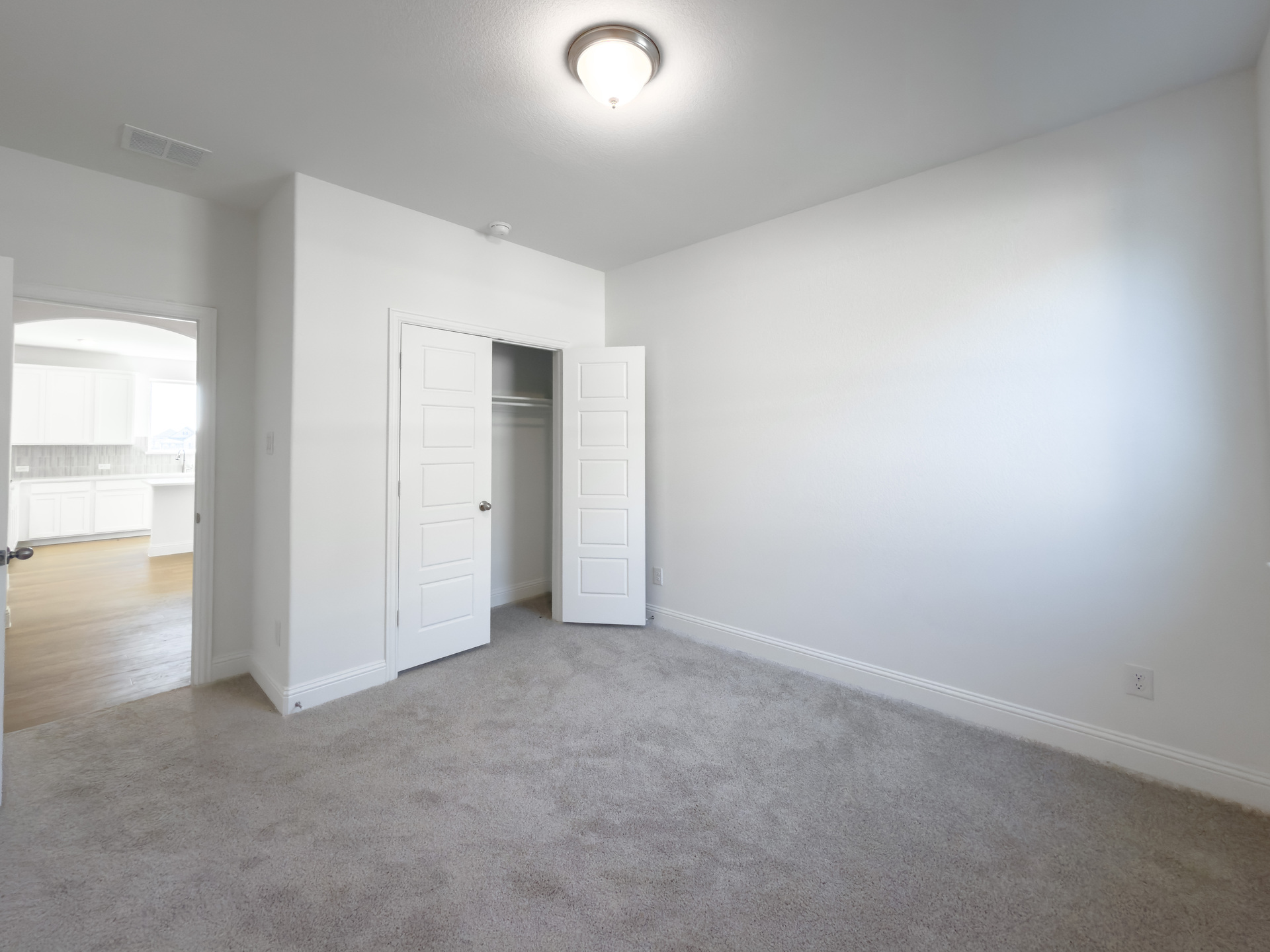 guest bedroom with carpet