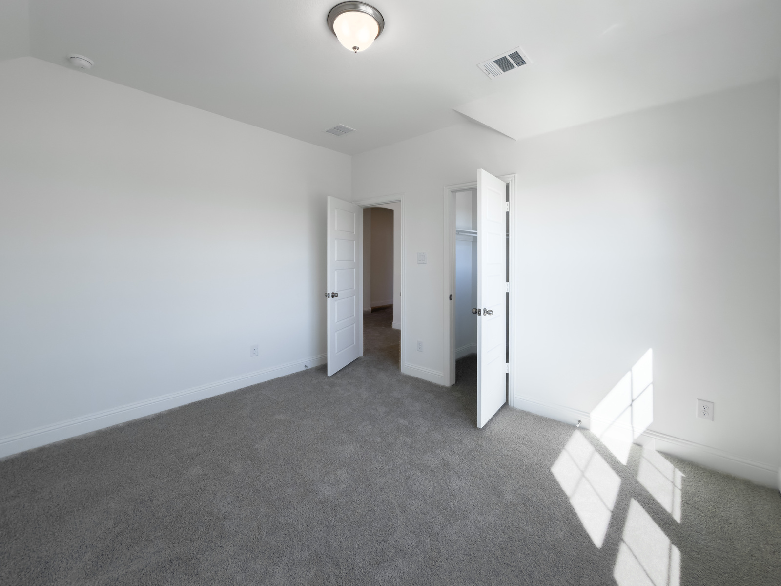 guest bedroom with carpet