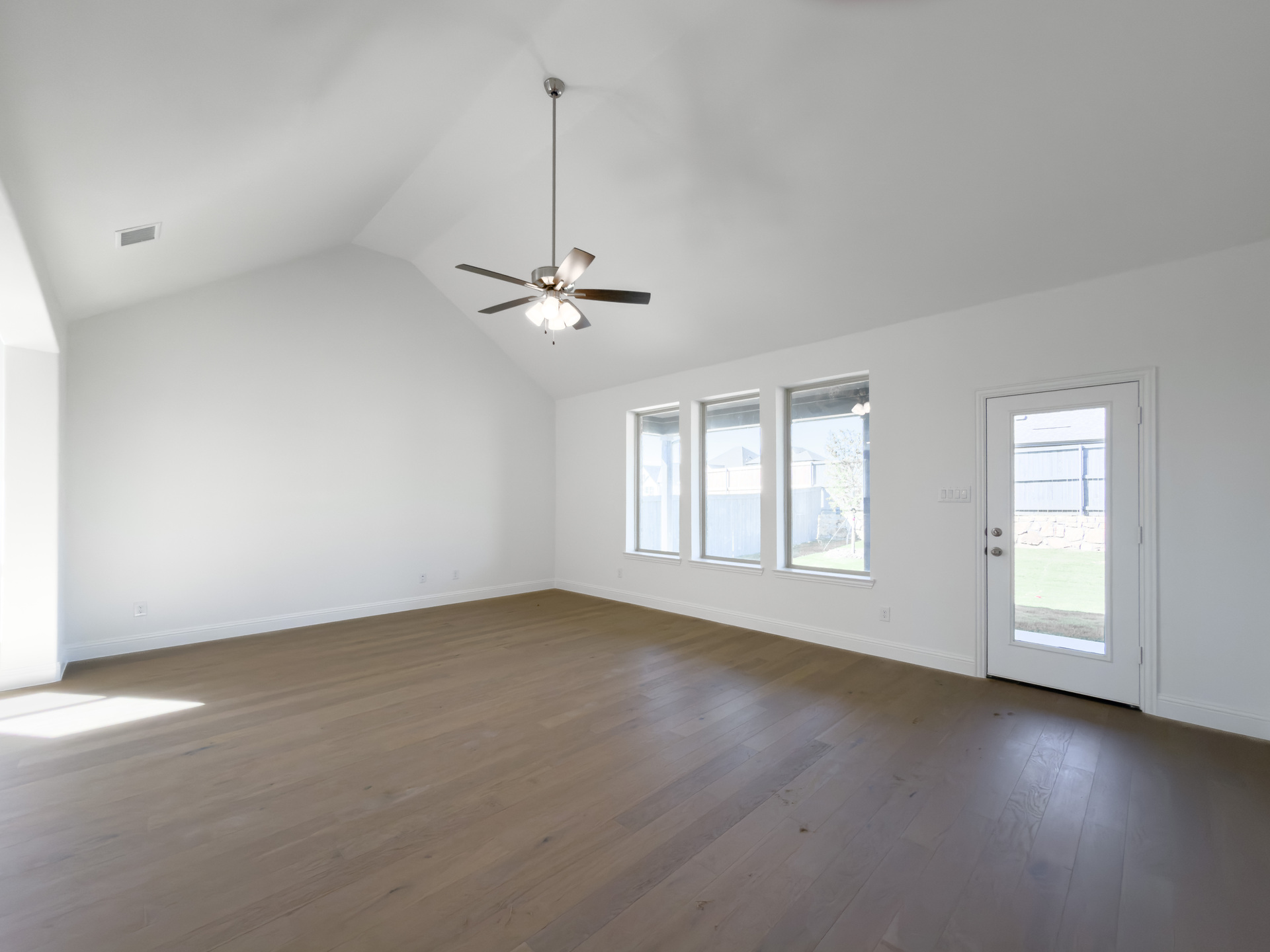 spacious great room with vaulted ceilings