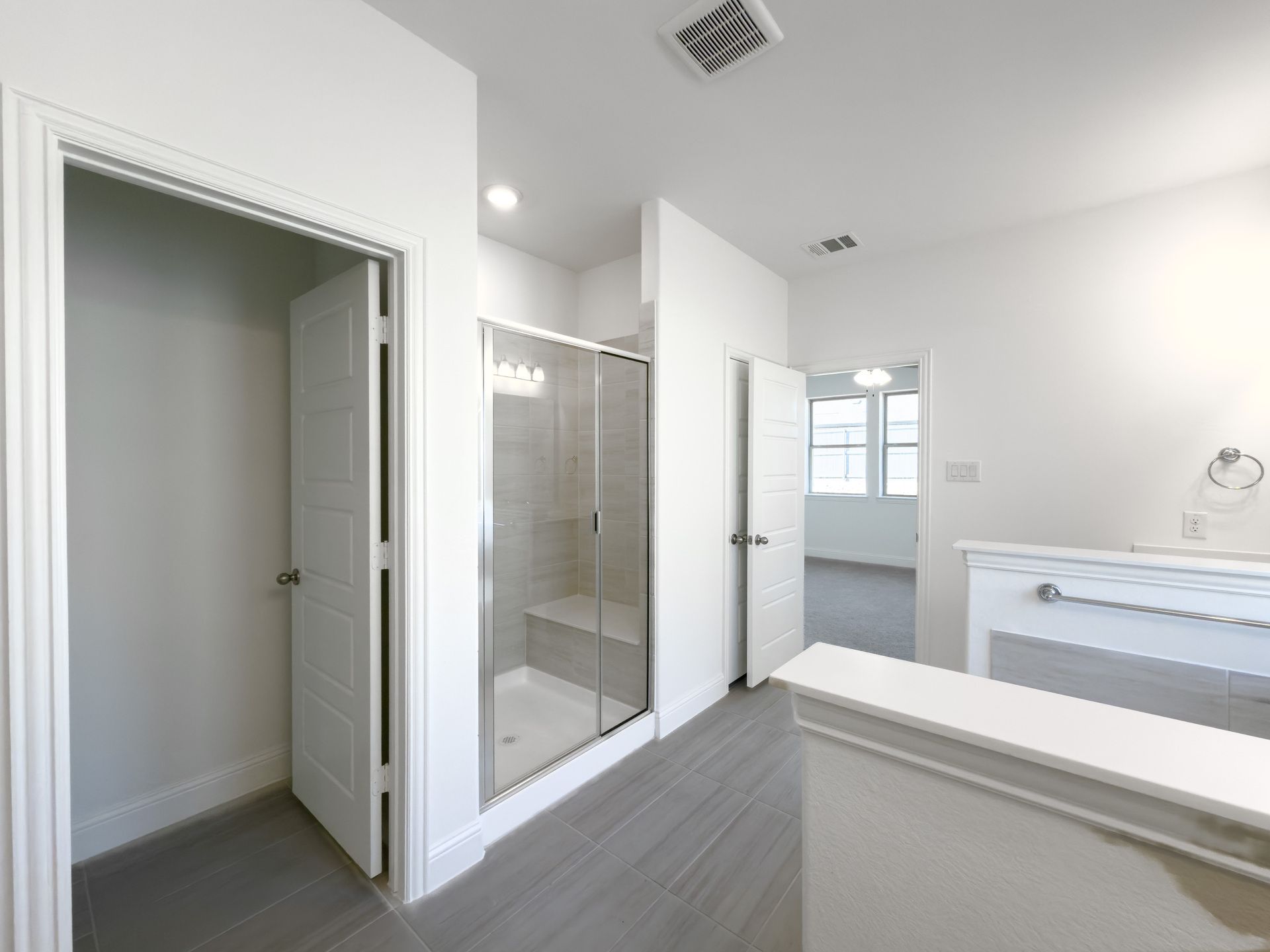 primary bathroom with separate walk-in shower and soaking tub