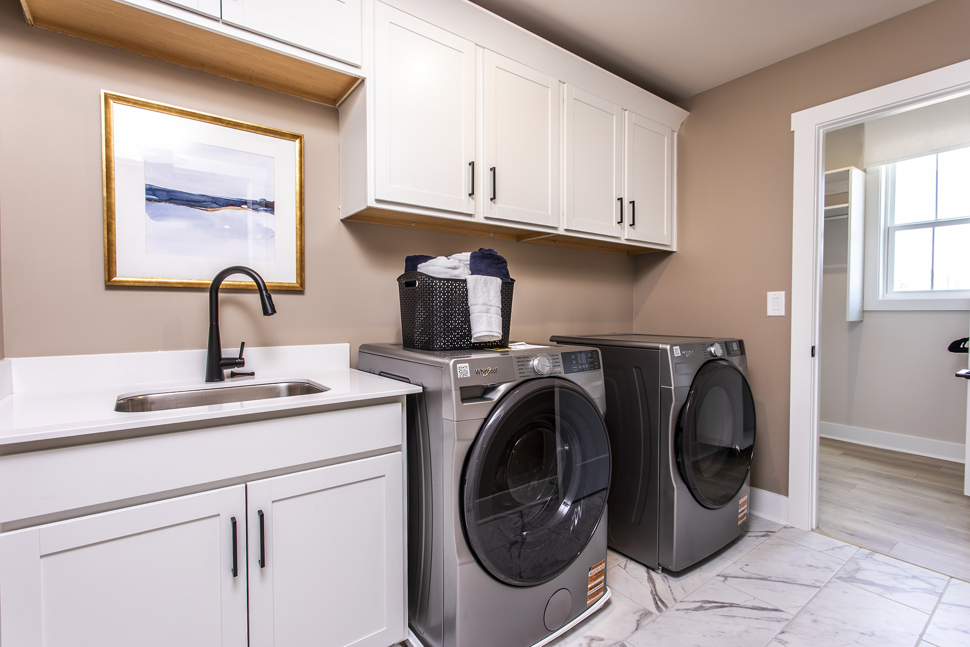 laundry room with washer, dryer and sink