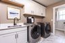 laundry room with washer, dryer and sink