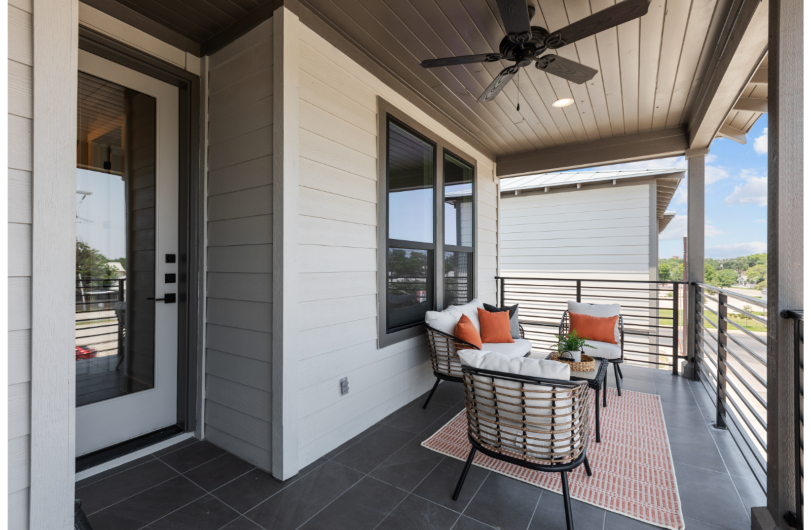 balcony on the 3rd floor with outdoor chairs