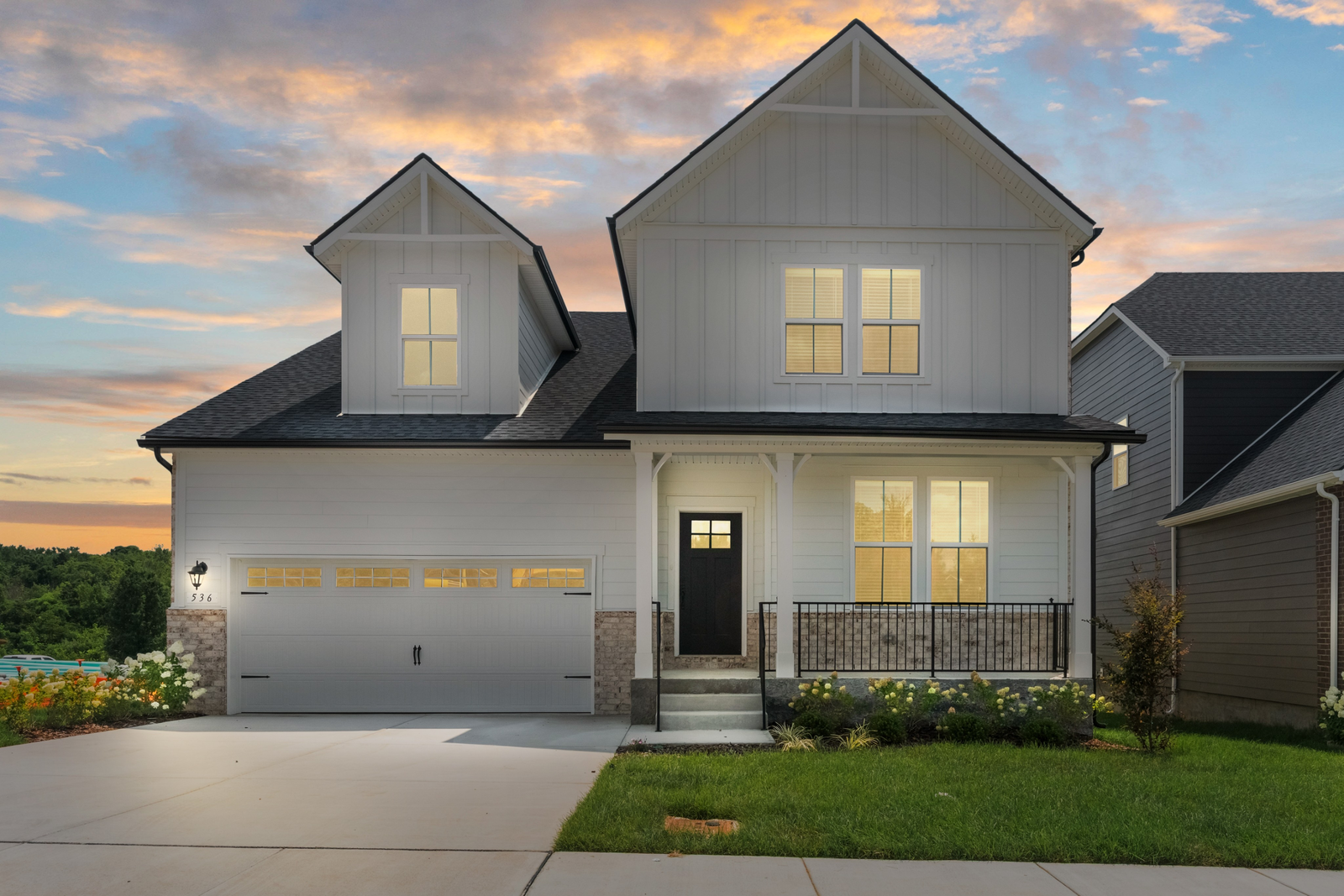 front exterior of home with brick entry and garage