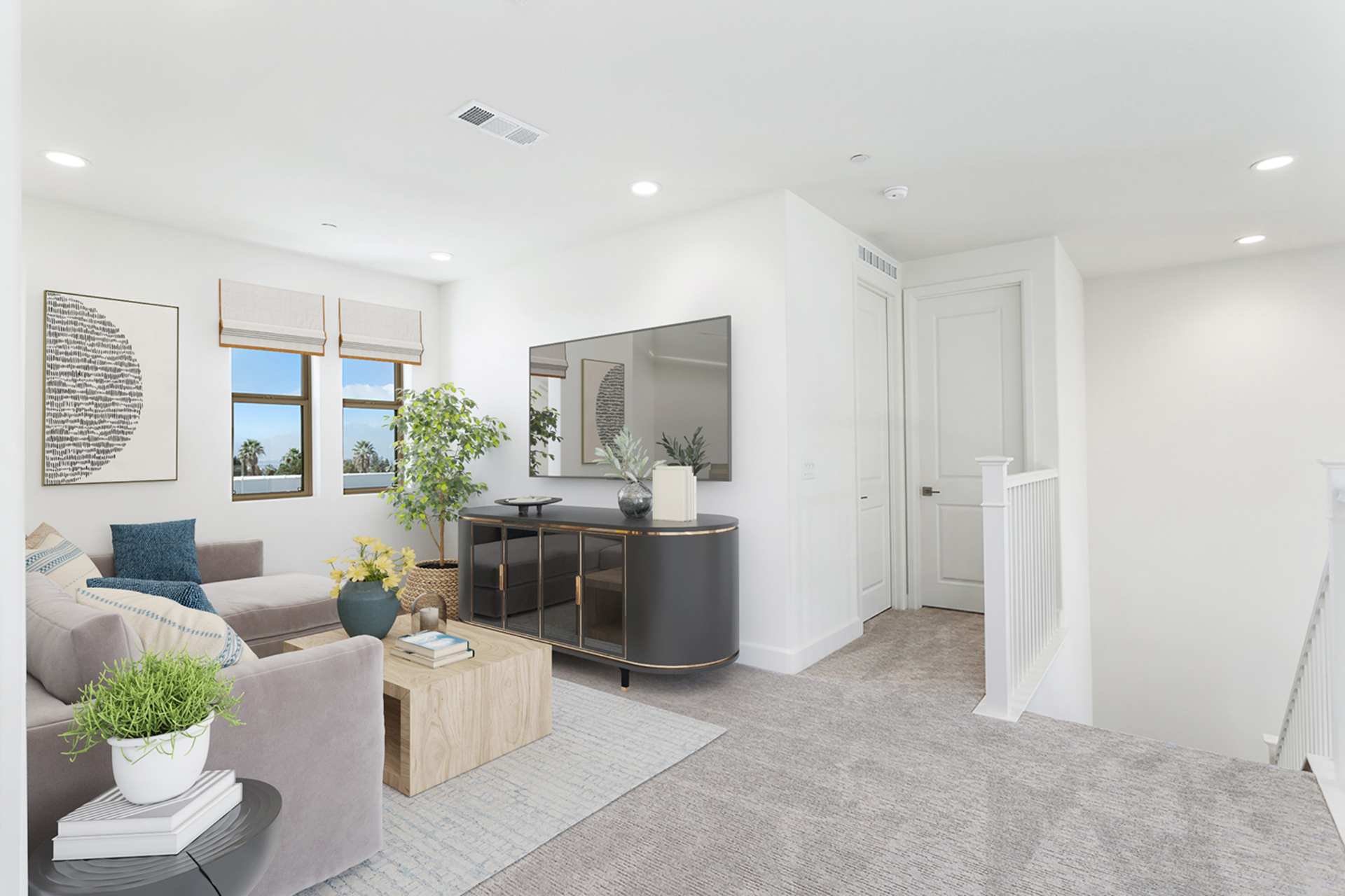 loft with neutral carpet and large windows