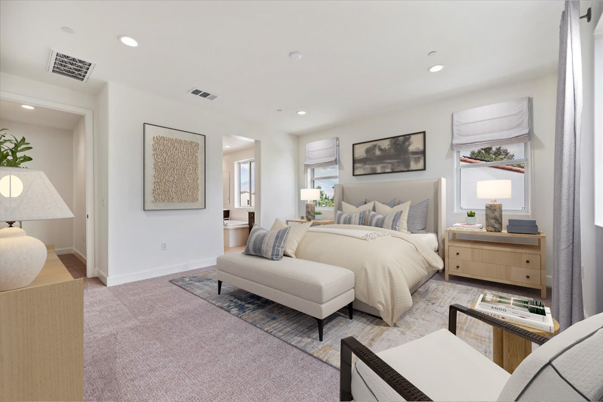 primary bedroom with neutral carpet and large windows