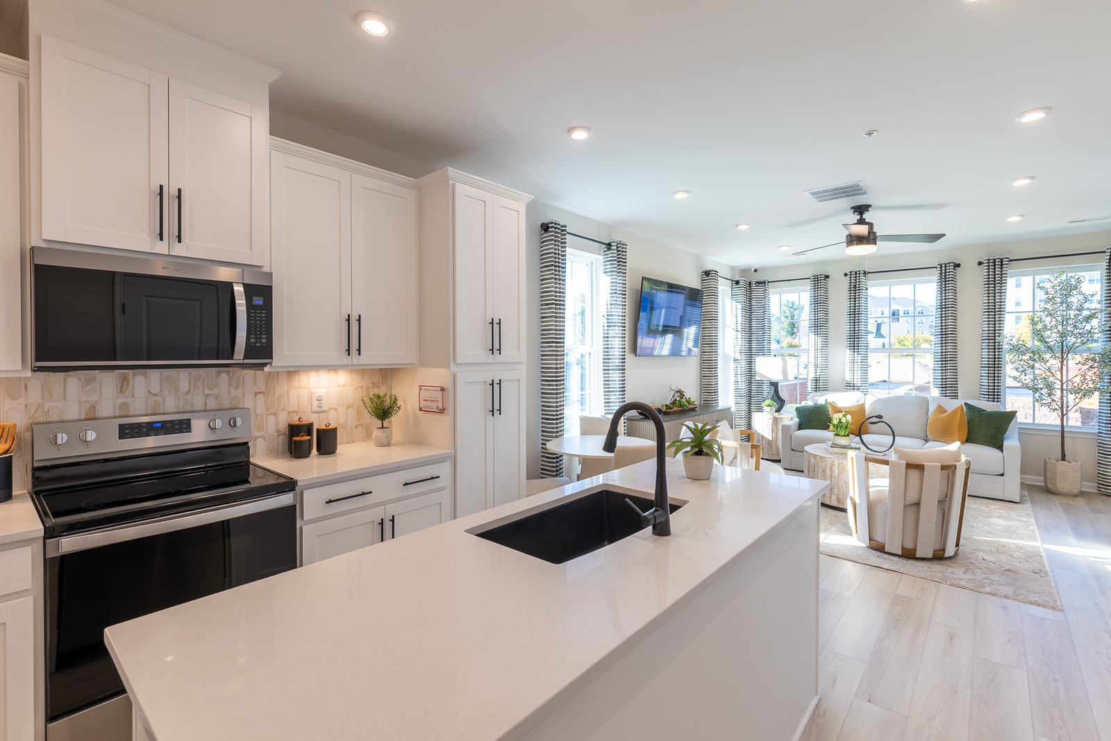 kitchen extending to the great room letting in an abundance of natural light