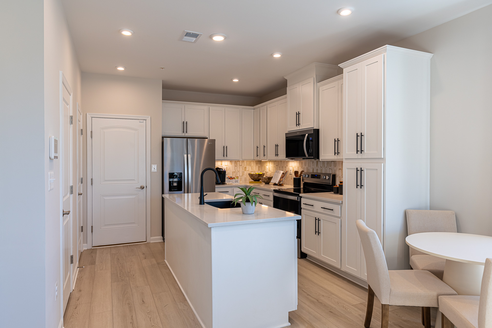 kitchen with center island and white cabinets