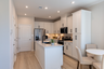 kitchen with center island and white cabinets