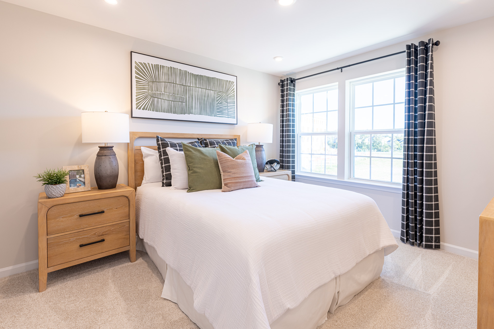secondary bedroom with a full sized bed and carpet
