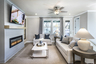 great room with electric fireplace and light flooring