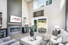 great room with electric fireplace & plank floors