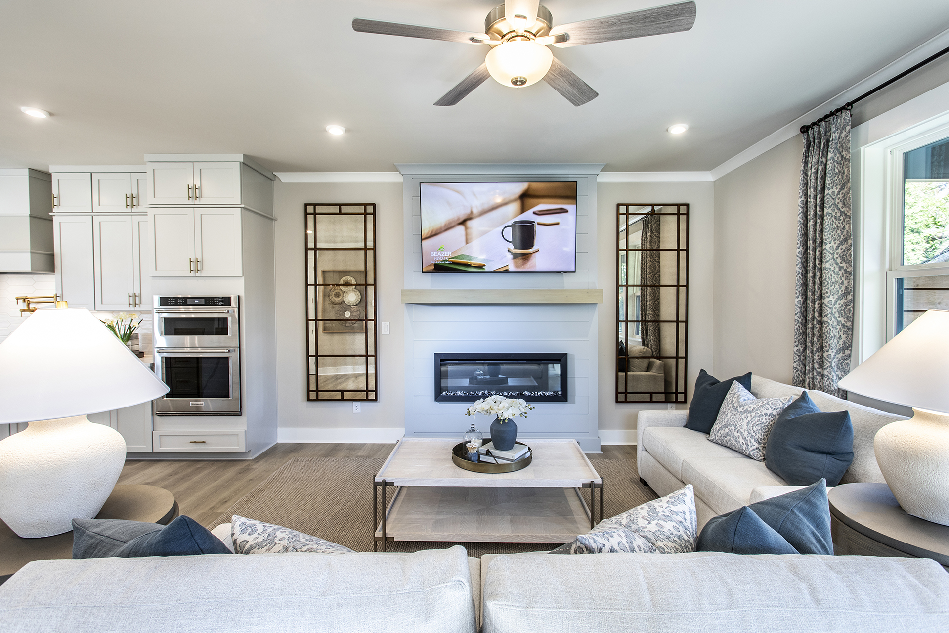 great room with electric fireplace and hard surface flooring