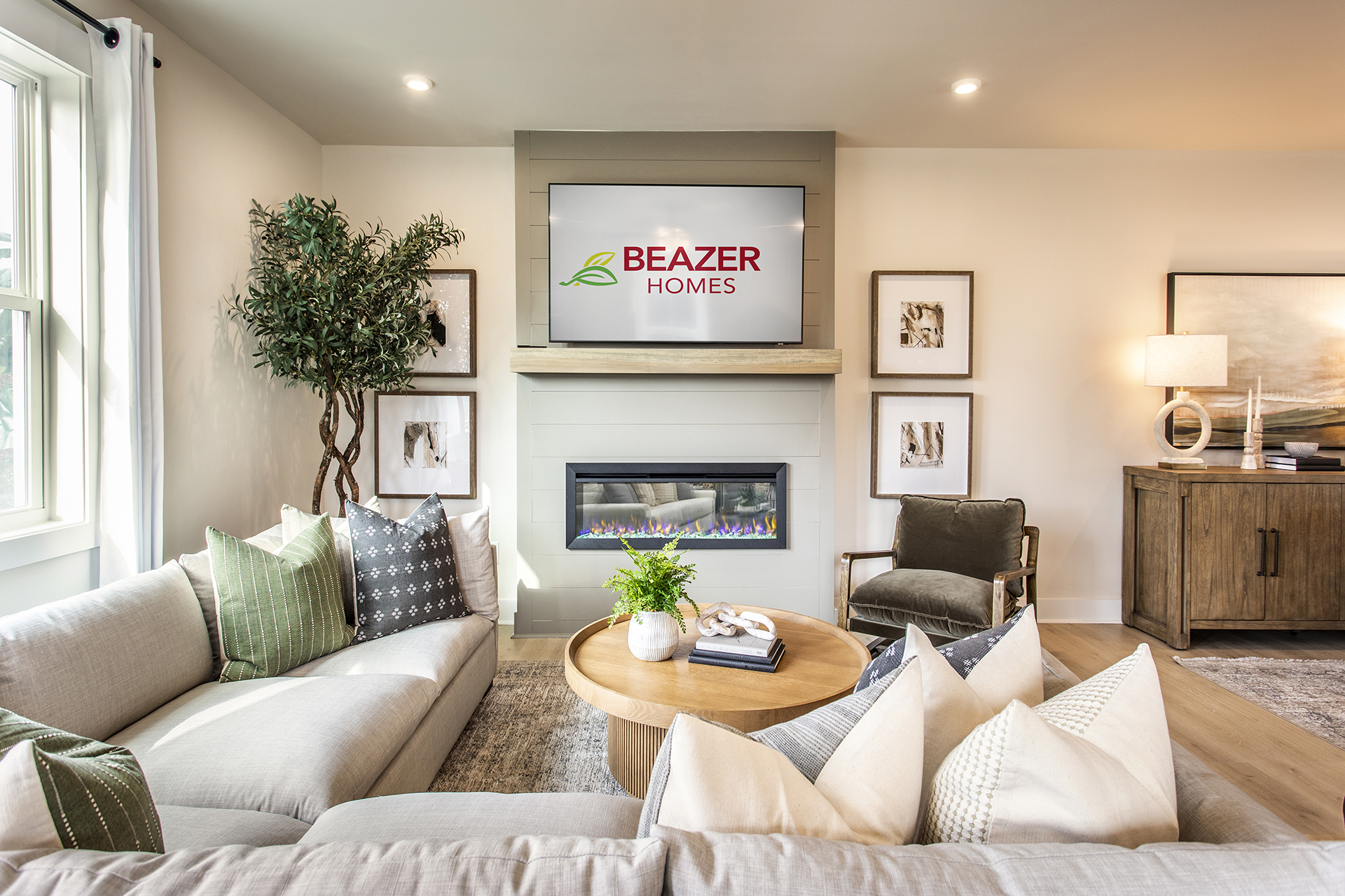 great room with electric fireplace and L-shaped couch