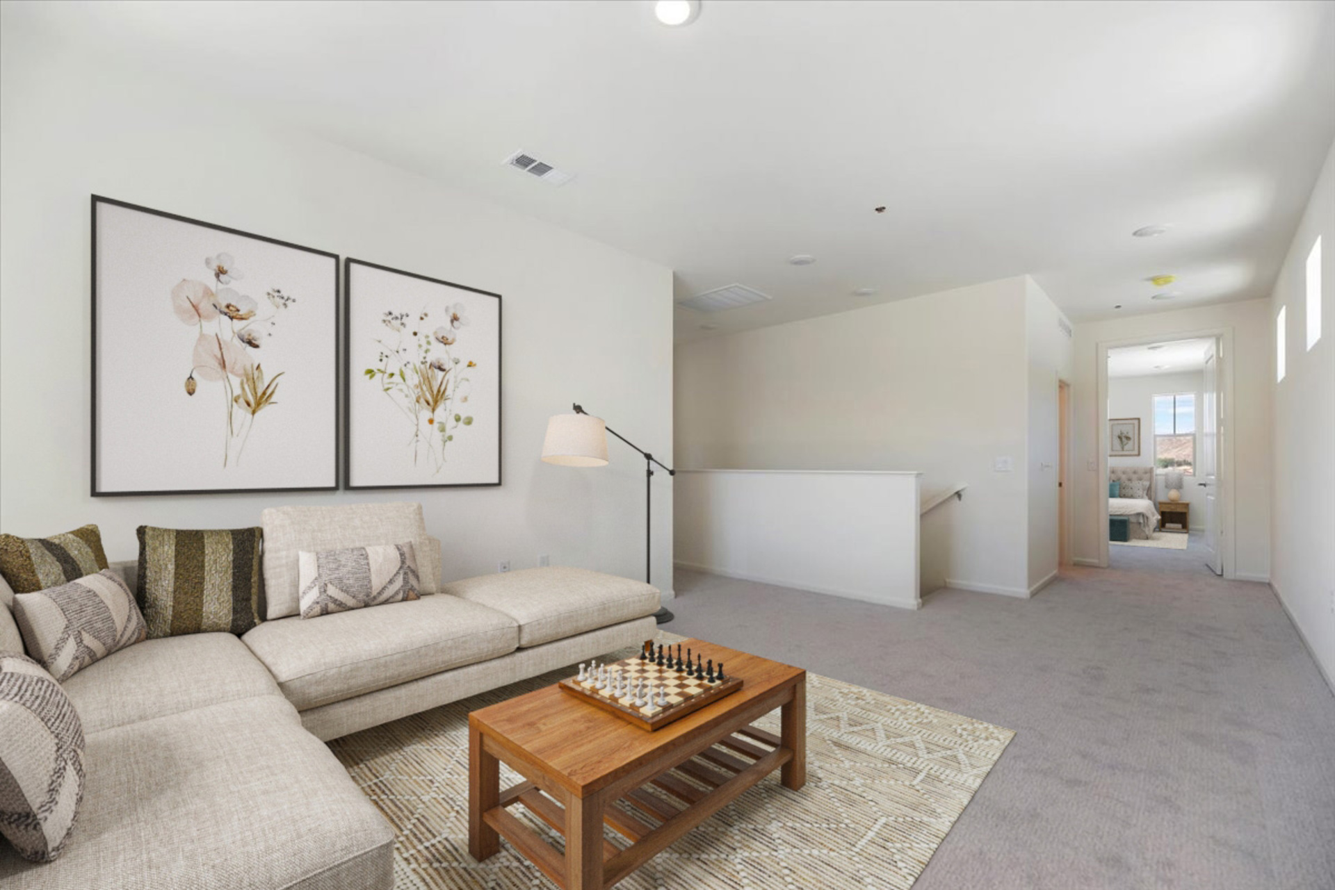 loft featuring a sectional and a table with chess on top