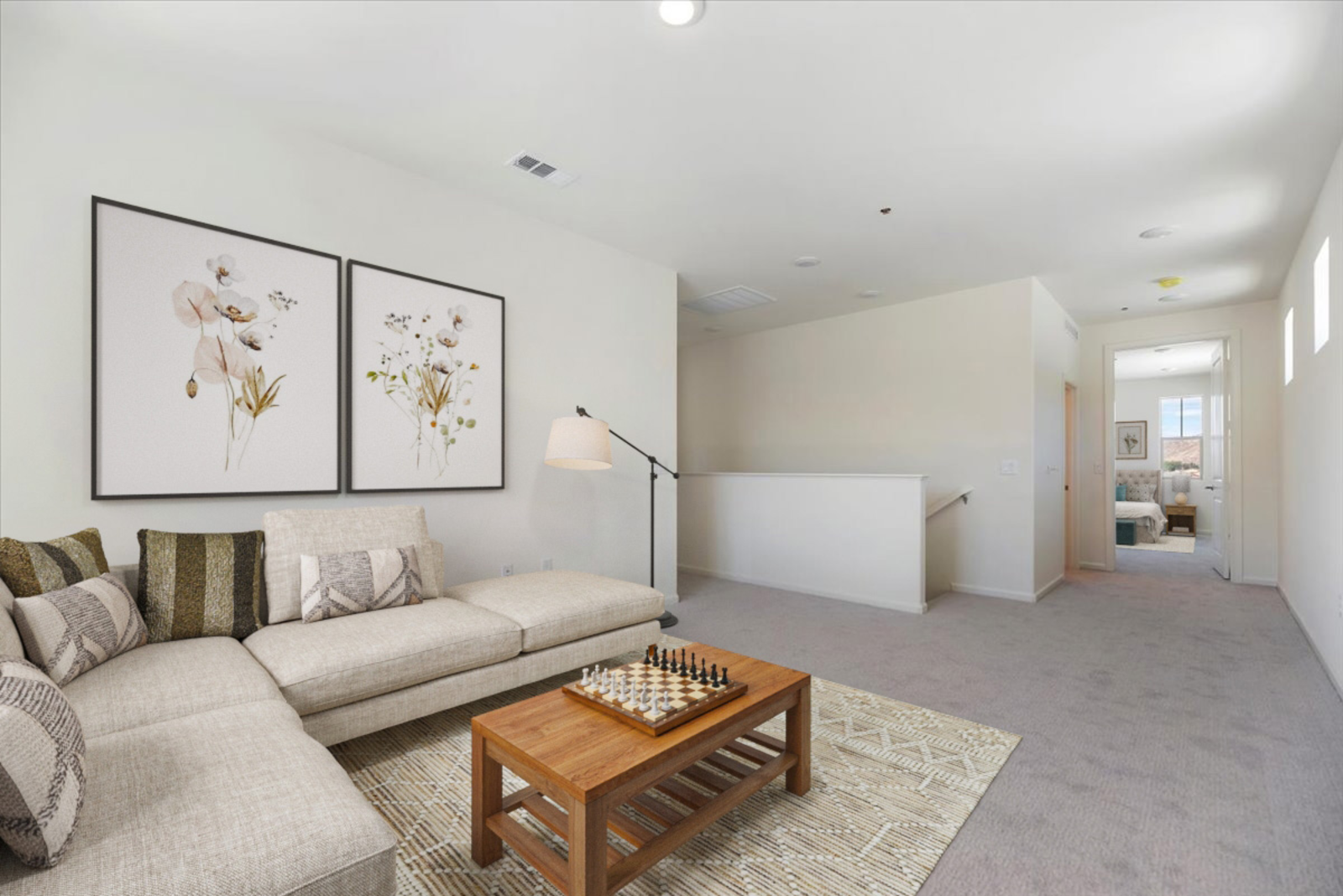 loft featuring a sectional and a table with chess on top
