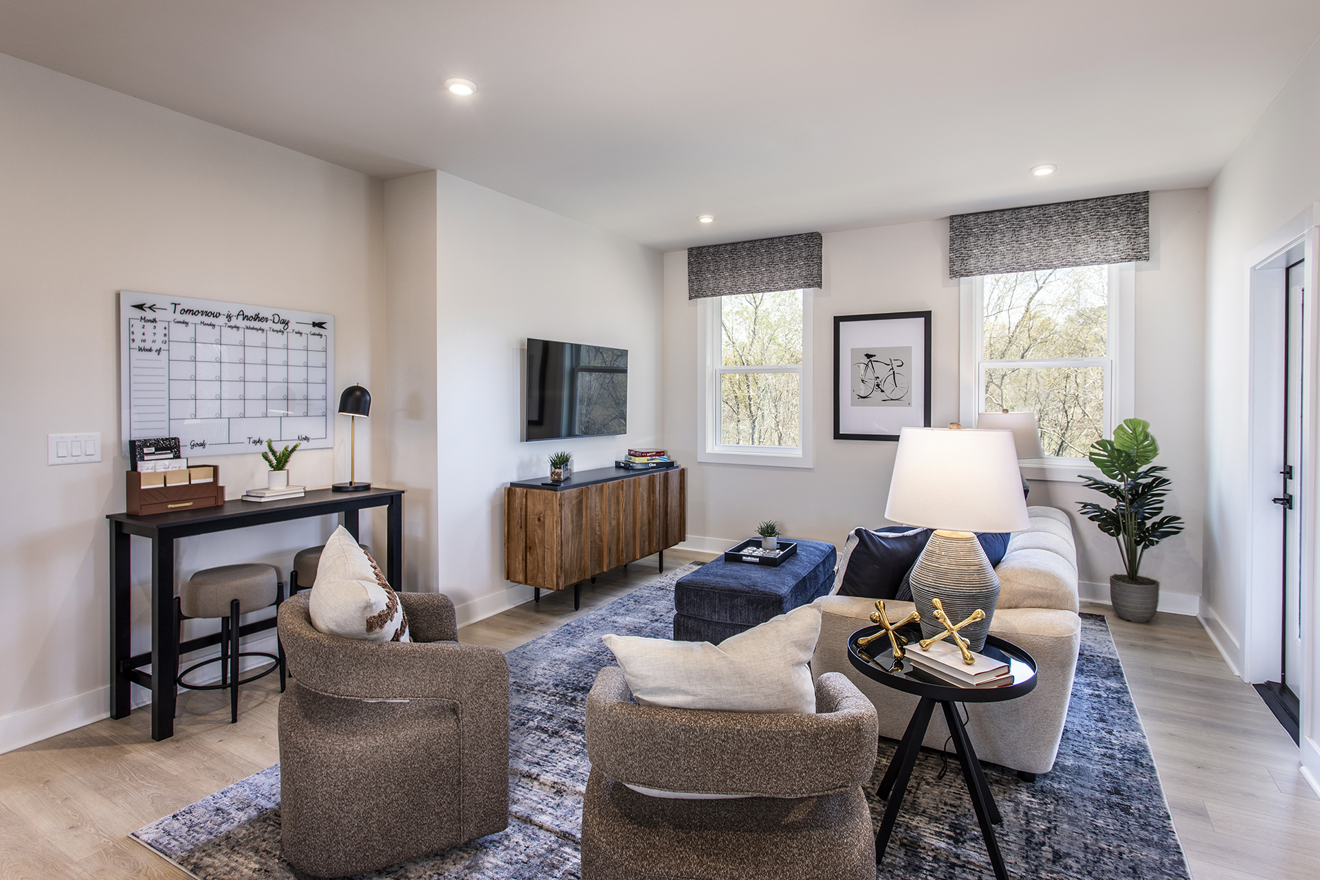 upstairs loft with desk and media room seating