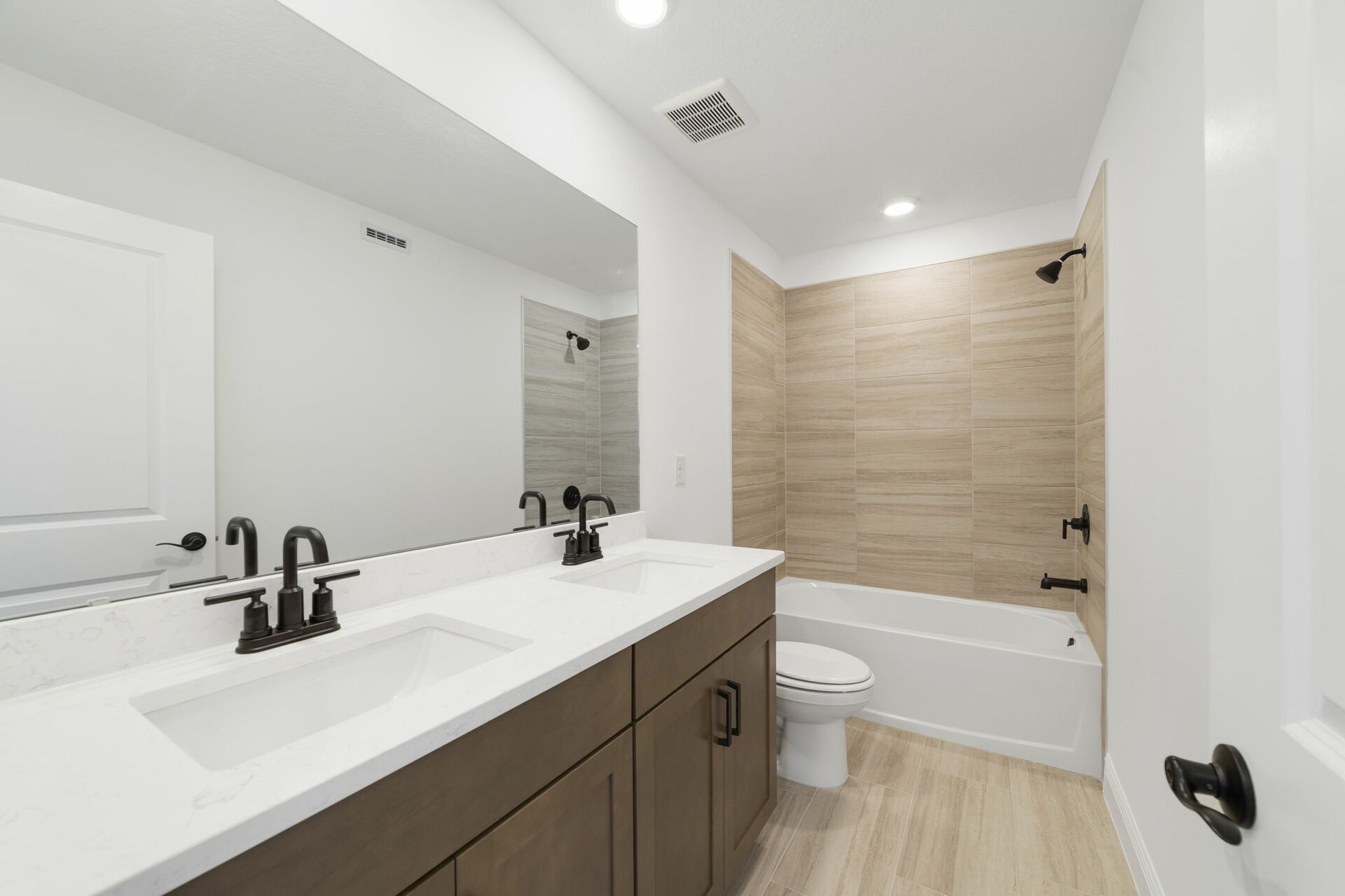 dual sink vanity with shower and water closet