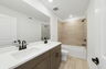 dual sink vanity with shower and water closet