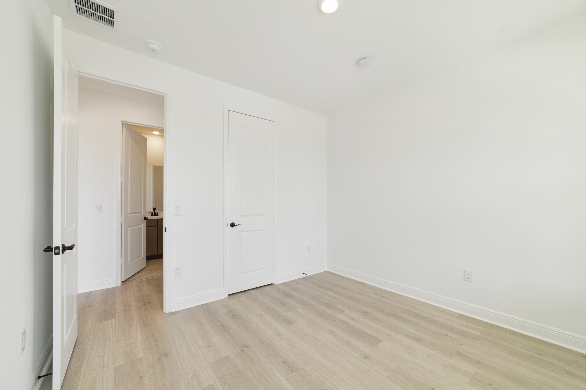 nice flooring throughout with a window and access to the closet