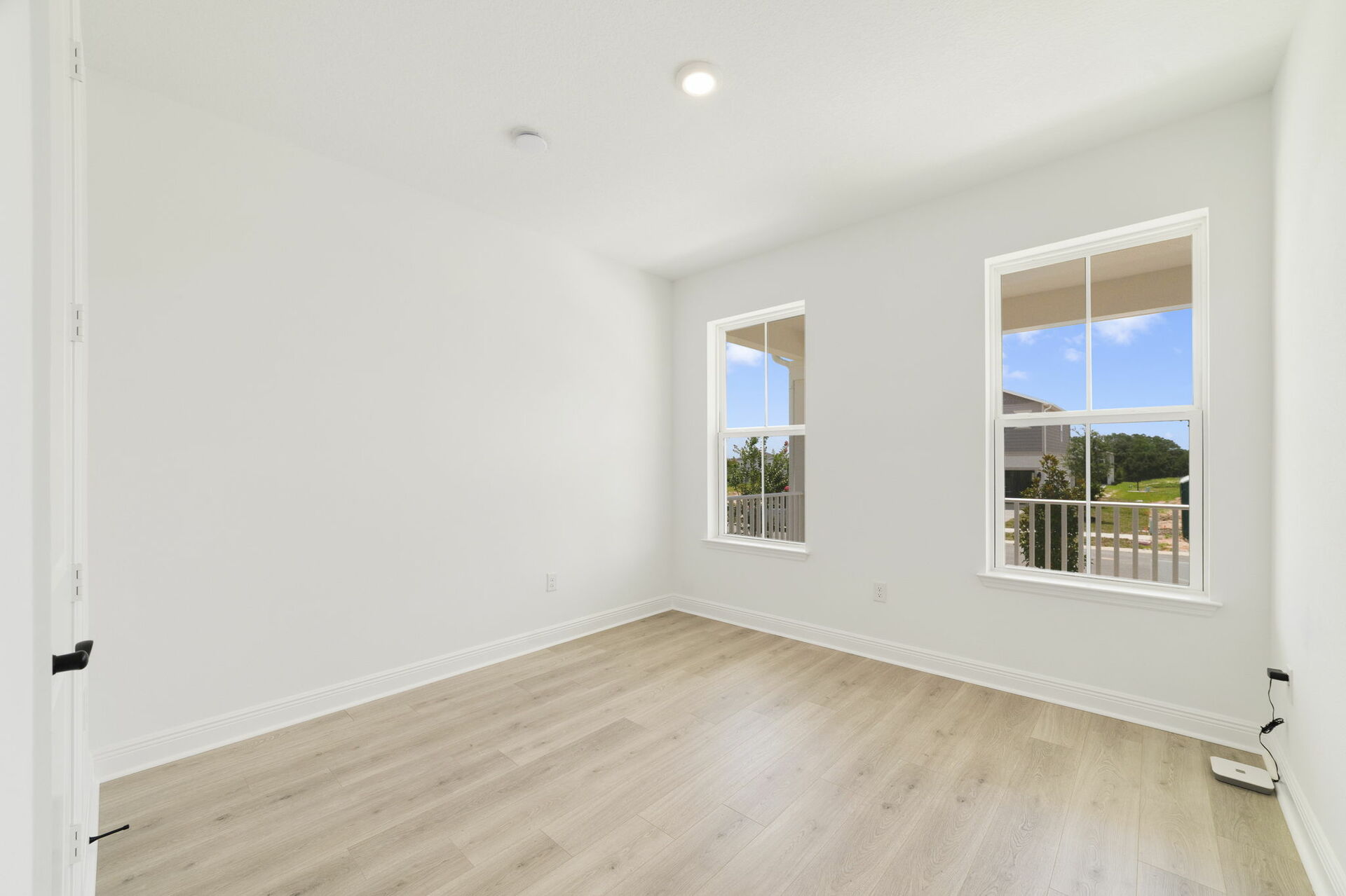 nice flooring throughout with a window and access to the closet