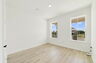 nice flooring throughout with a window and access to the closet