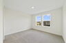 carpet throughout with multiple windows