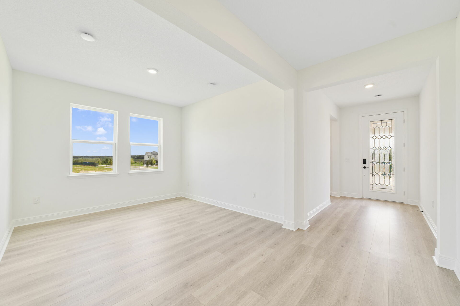 room with large windows and access to the great room