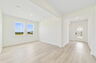 room with large windows and access to the great room