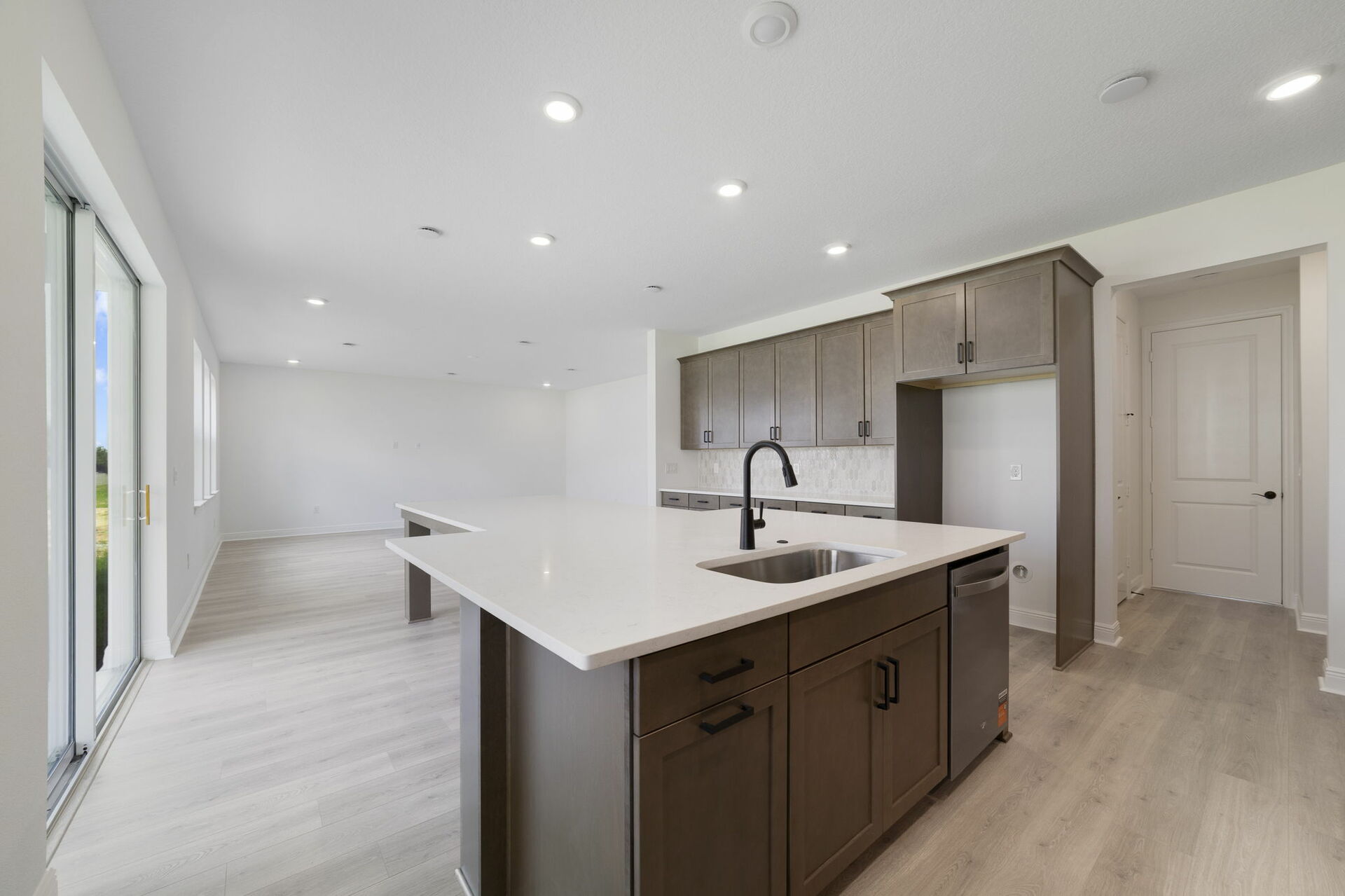kitchen with view of the great room and access to the lanai