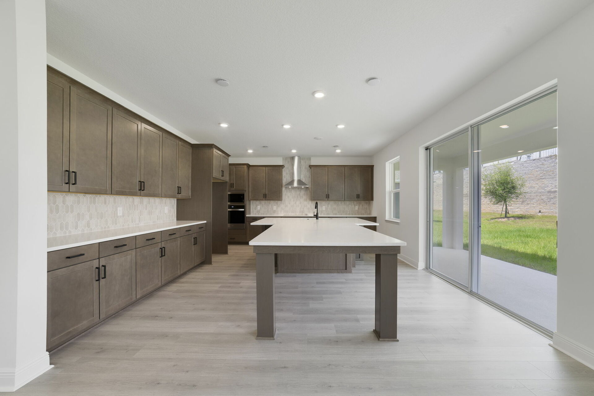 kitchen with view of the great room and access to the lanai