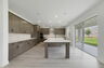 kitchen with view of the great room and access to the lanai