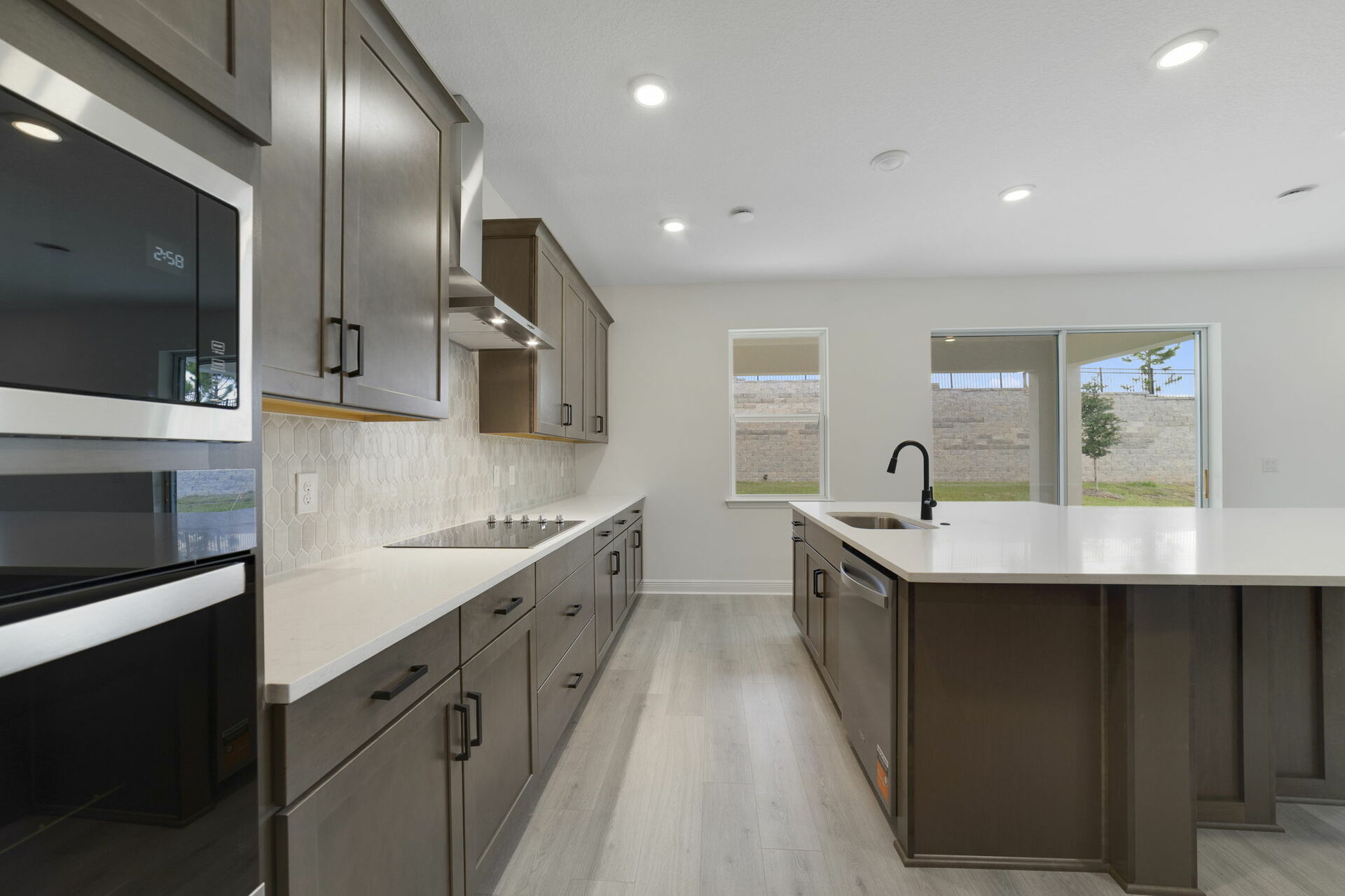 kitchen with view of the great room and access to the lanai