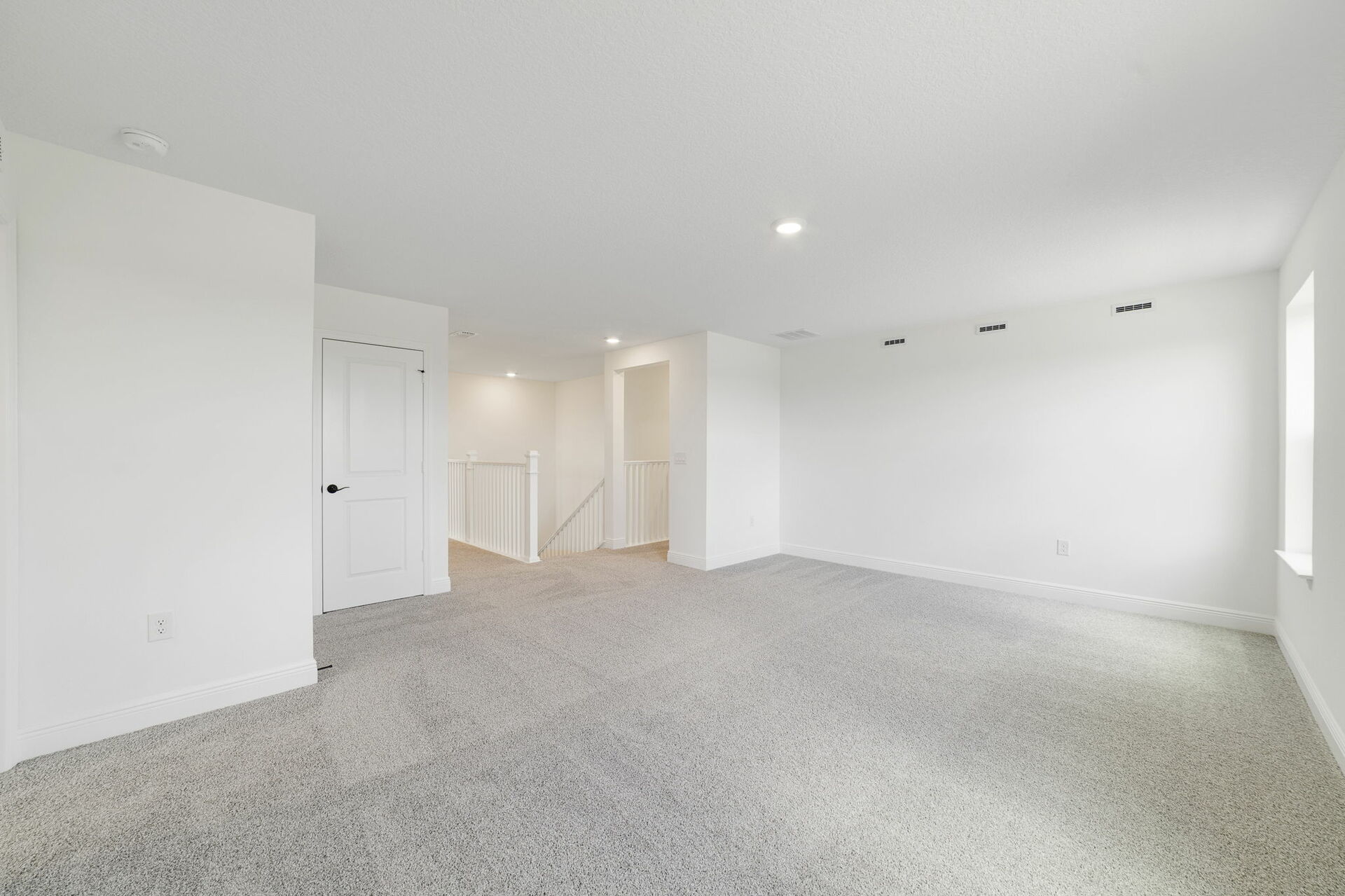 carpet throughout, large space, and multiple windows 