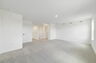 carpet throughout, large space, and multiple windows 