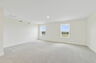 carpet throughout, large space, and multiple windows 