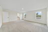 carpet throughout with multiple windows and access to the primary bathroom
