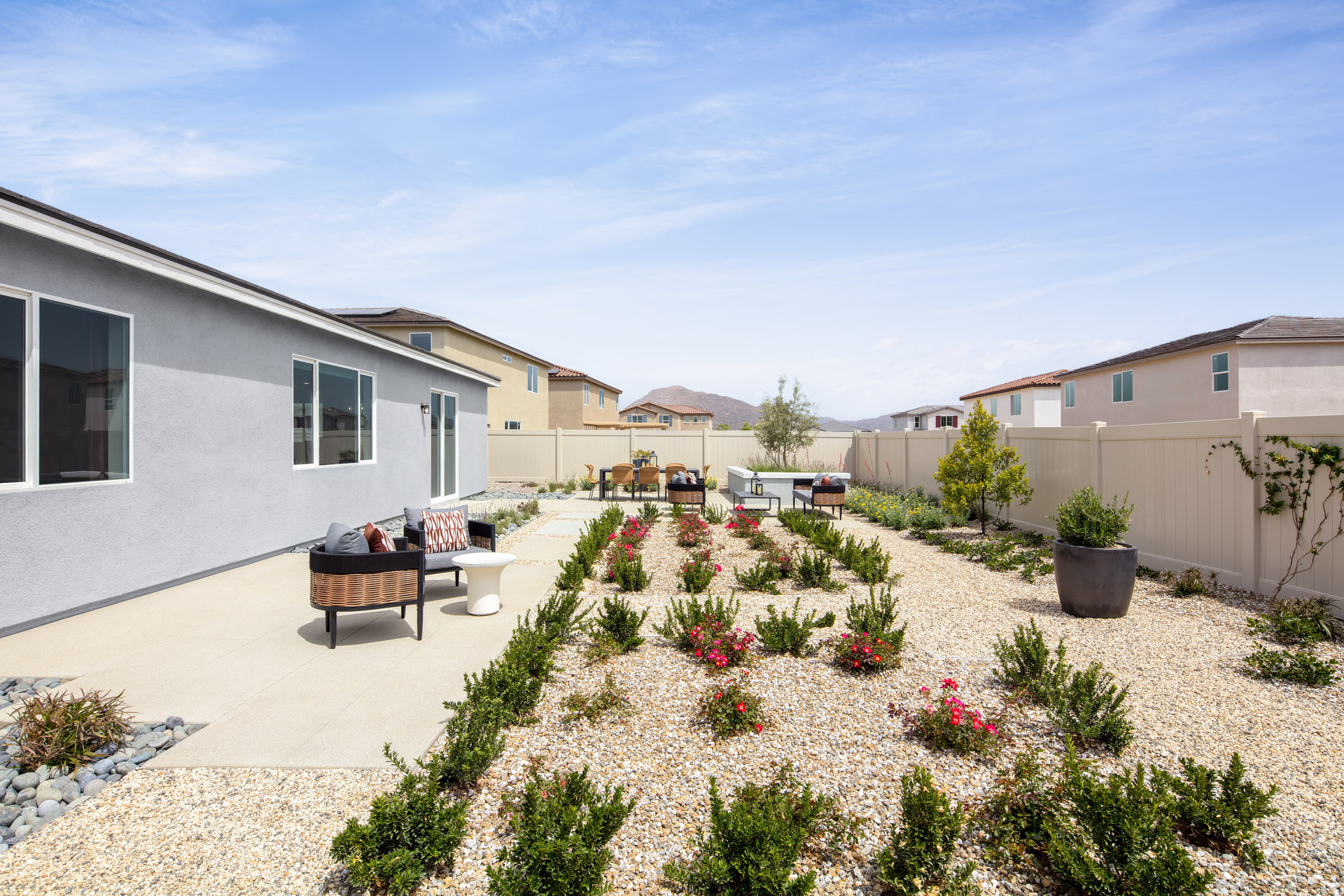 backyard with desert landscaping and seating area
