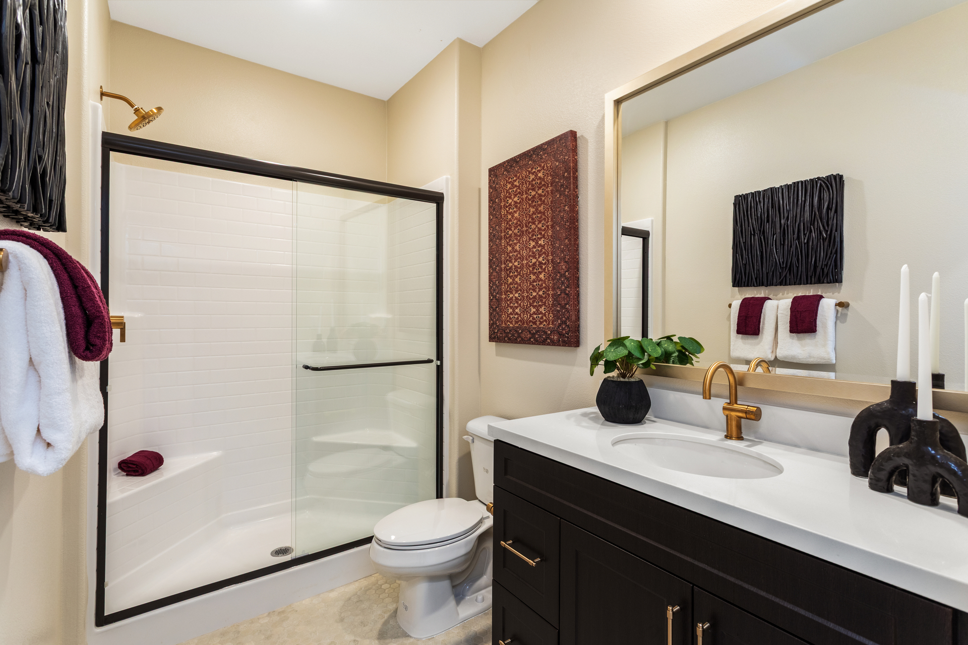 bathroom with dark cabinets and white countertops