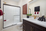 bathroom with neutral floors and white countertops