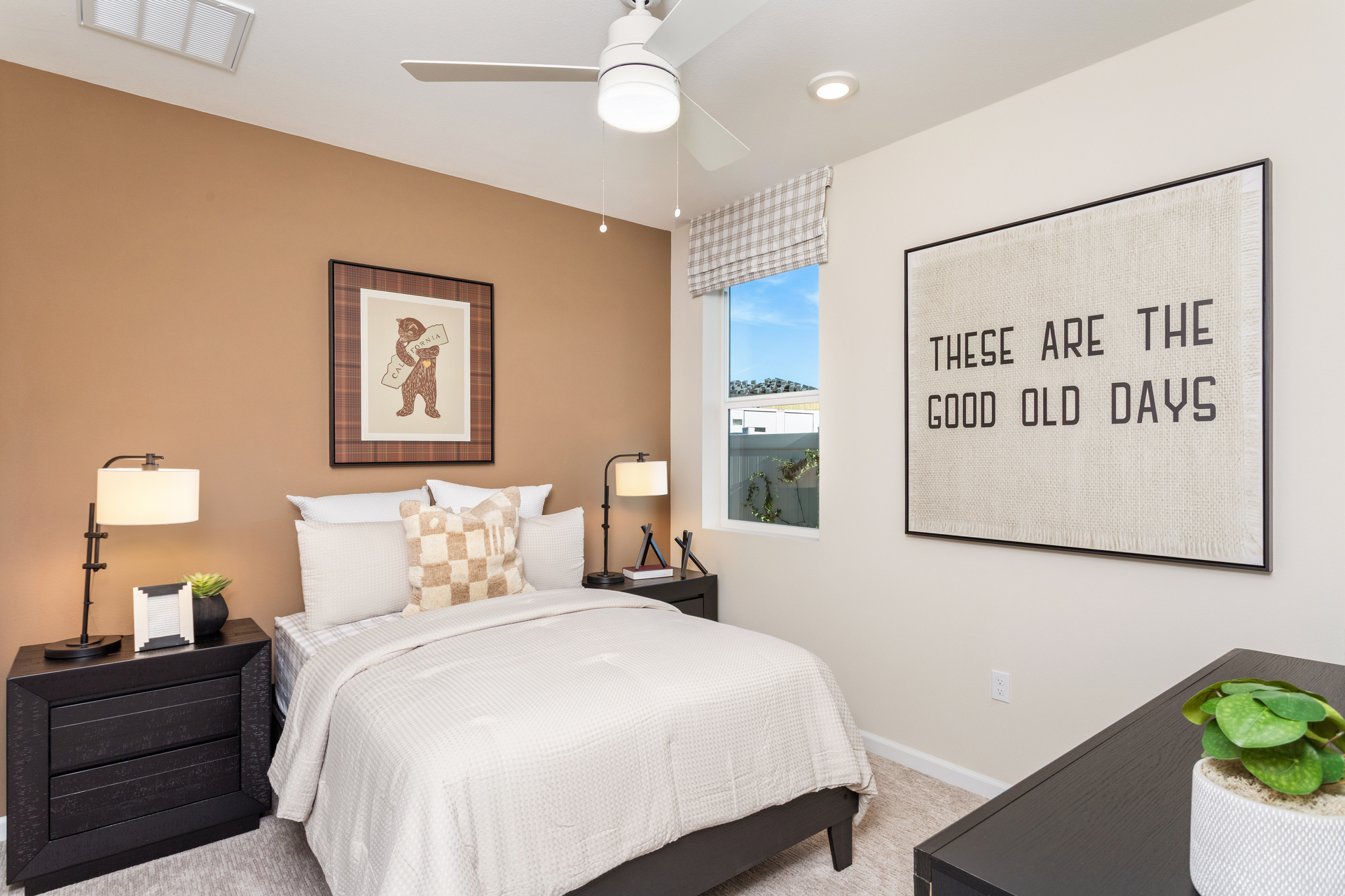 bedroom with neutral flooring and large window